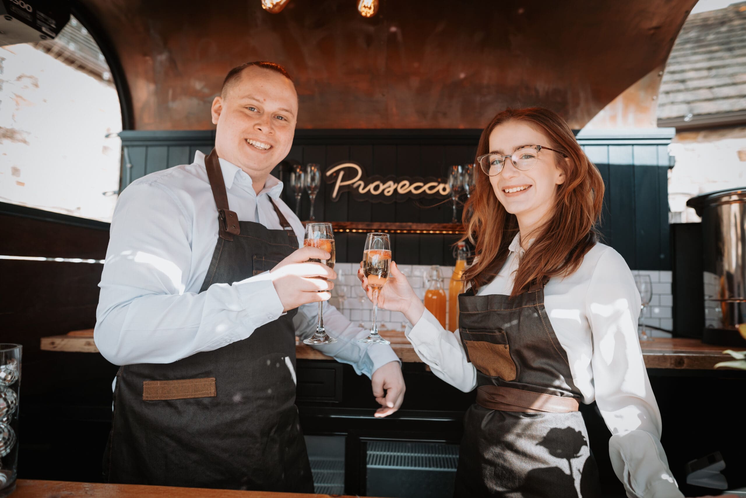 Brendan and Sara, owners of The Bubble Box in their mobile Prosecco bar.